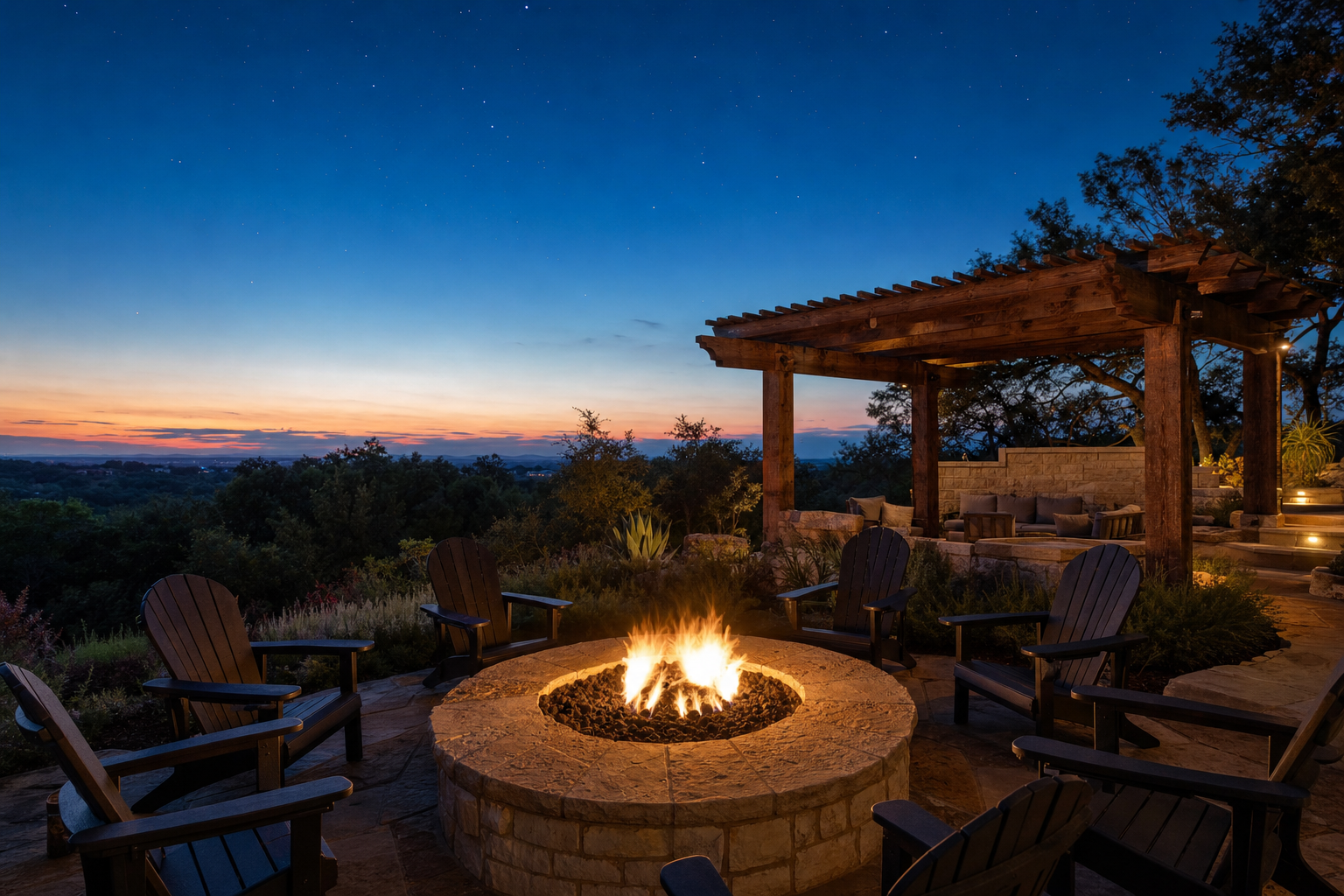 Custom limestone fire pit with cedar pergola at twilight in the Texas Hill Country
